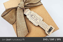 Load image into Gallery viewer, Gift box with a guitar-shaped tag and burlap ribbon on a light gray background