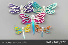 Load image into Gallery viewer, Colorful dragonfly-shaped cutouts on a gray background with 'DIY Craft Tutorials' logo.
