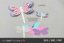 Load image into Gallery viewer, Paper cutout dragonflies with layers on a gray background, featuring text about layers and SVG/DXF/PDF formats.
